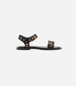 Black flat sandals with gold buckles from Mango – ideal for spring capsule styling.