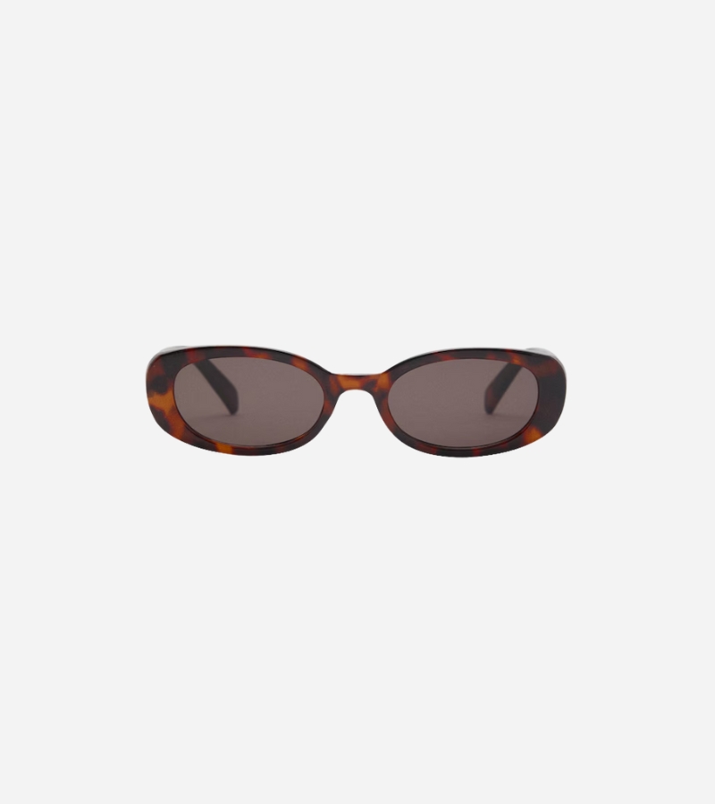 Oval tortoiseshell sunglasses from Mango – a retro-inspired accessory for spring capsule looks.