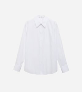 Classic white cotton shirt from Mango – a timeless piece for any minimalist spring capsule wardrobe.