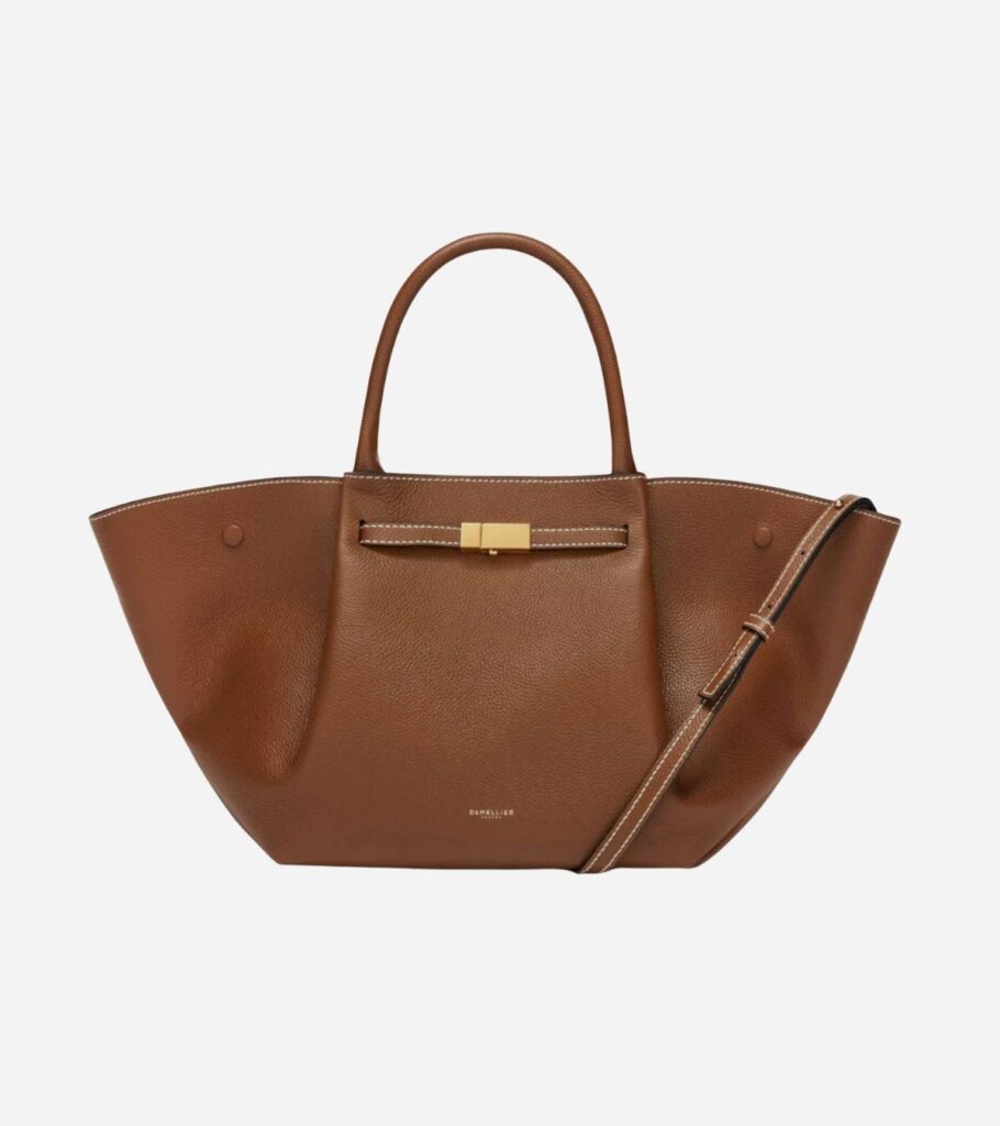Minimalist designer leather tote bag by DeMellier, structured and timeless in neutral tone.