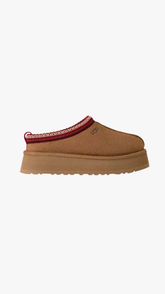 Birkenstock Boston shearling clogs in stone suede with closed toe and cork footbed.