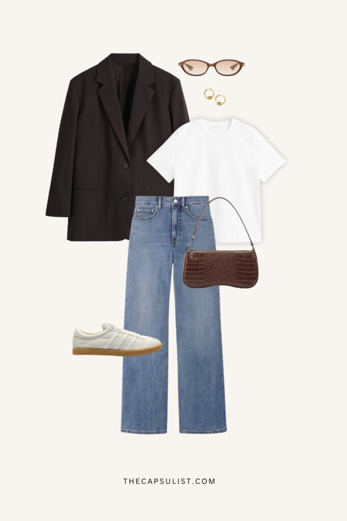 Minimalist quiet luxury outfit with a black oversized blazer, white T-shirt, wide-leg blue jeans, white retro sneakers, brown croc-embossed shoulder bag, gold hoop earrings, and narrow cat-eye sunglasses on a neutral background.