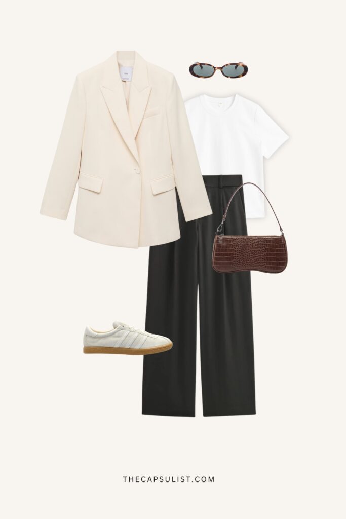 Minimalist quiet luxury outfit with a cream blazer, white T-shirt, black wide-leg trousers, white retro sneakers, brown croc-embossed shoulder bag, gold hoop earrings, and tortoise sunglasses on a clean neutral background.