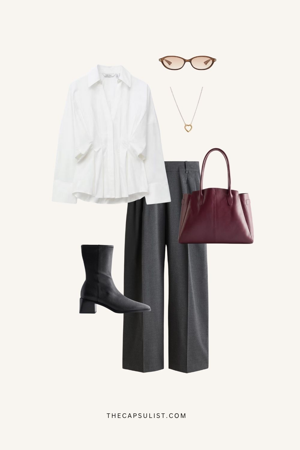 Minimalist winter outfit featuring white blouse, grey trousers, black ankle boots, and burgundy bag. Quiet luxury capsule wardrobe look from The Capsulist.