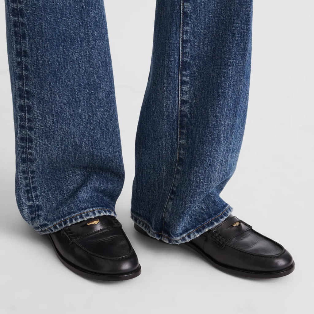 Black Madewell Grayson penny loafers worn with straight-leg denim, minimalist everyday styling