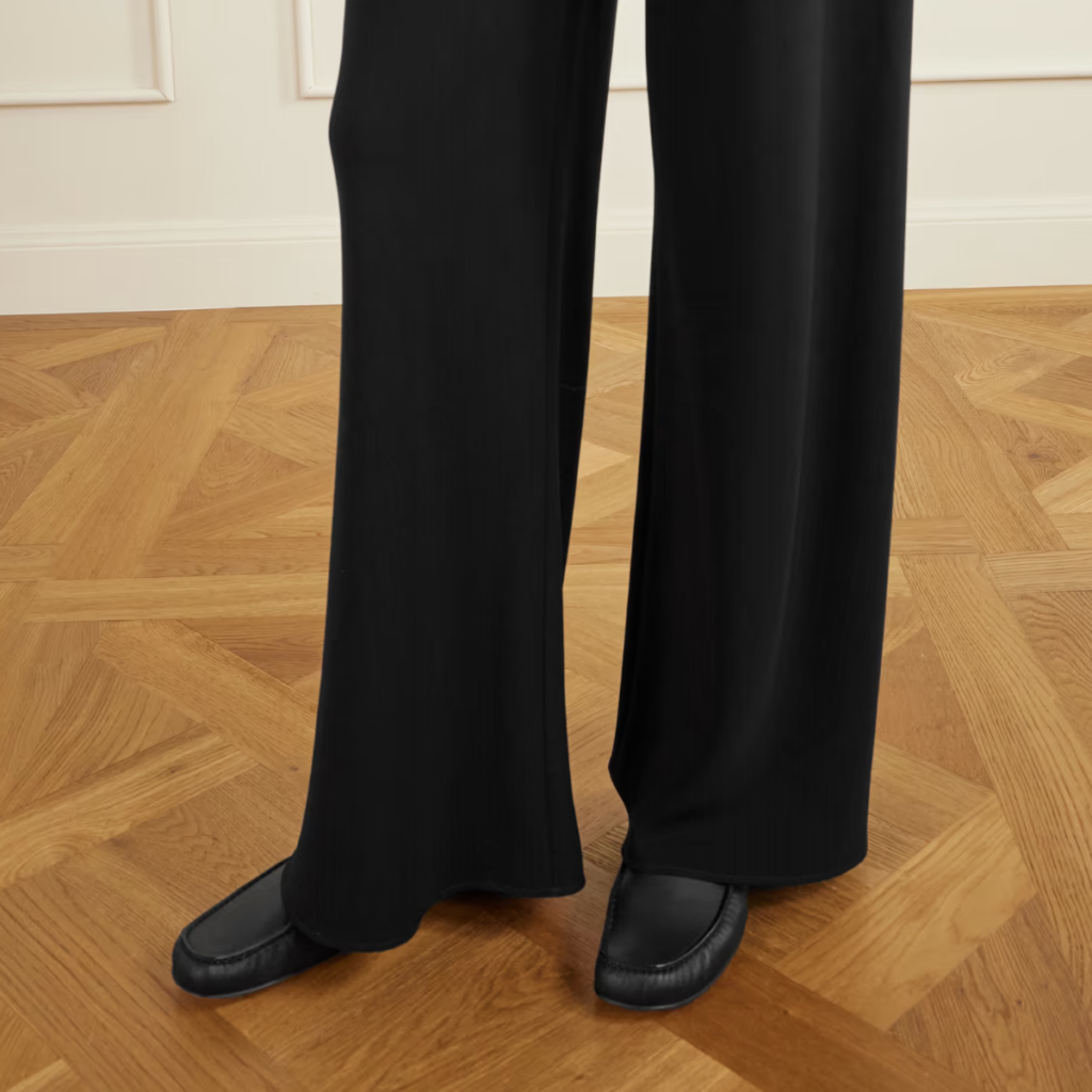 Black The Row leather loafer with minimalist slip-on silhouette and soft leather finish