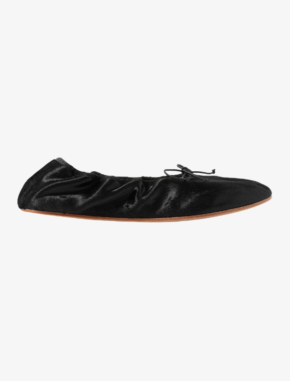 Black velvet ballet flats by The Row with soft gathered leather and minimalist silhouette for a capsule wardrobe