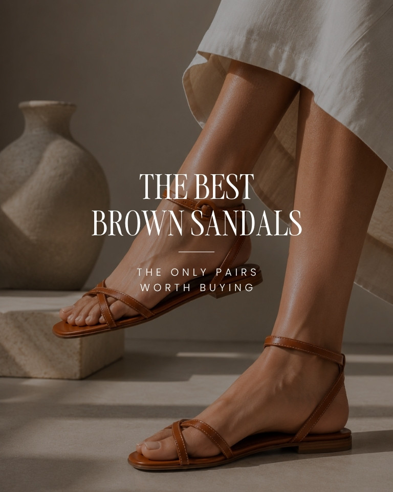 Brown leather flat sandals for women styled with a white summer dress in a luxury editorial studio.